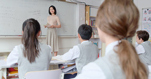 Young Chinese teacher teaching a class,4K
