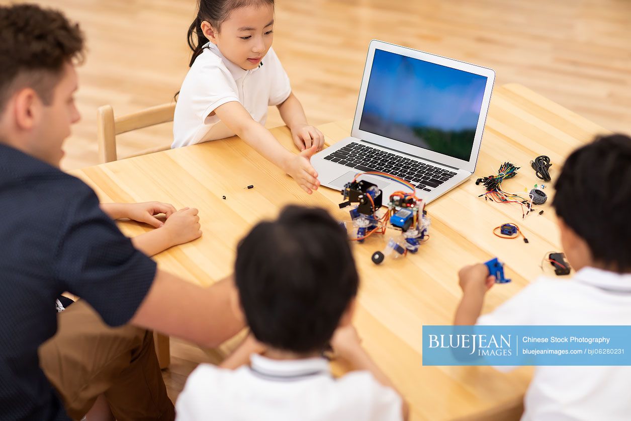 Children learning coding in classroom