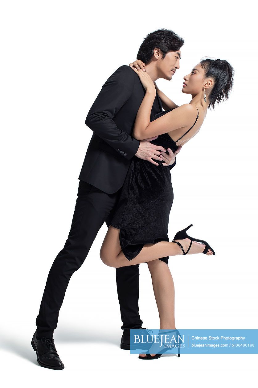 Studio shot of fashionable Chinese couple