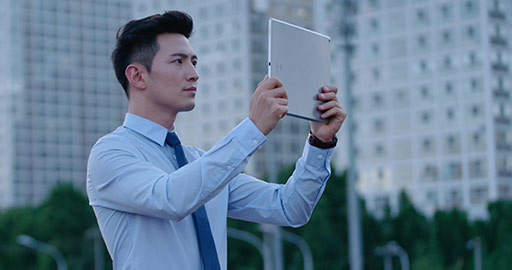 Young Chinese businessman using digital tablet,4K