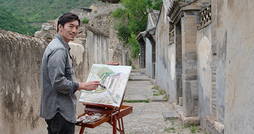 Young Chinese man painting outdoors,4K