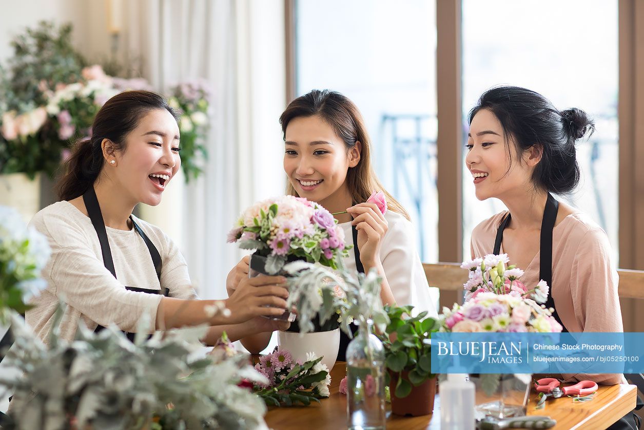 Young Chinese women learning flower arrangement
