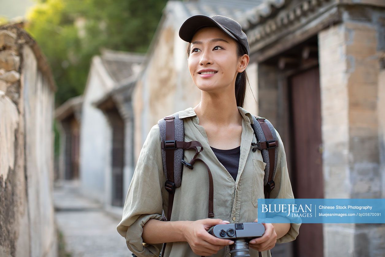 Chinese photographer taking photos in village