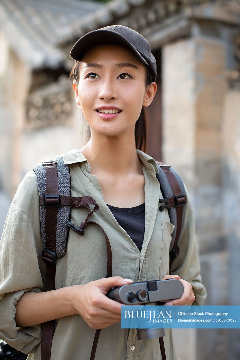 Chinese photographer taking photos in village