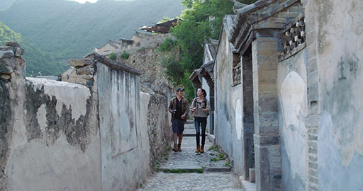 Young Chinese couple hiking in village,4K