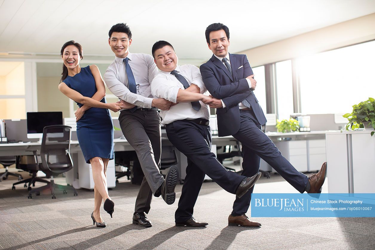 Chinese business people playing in office