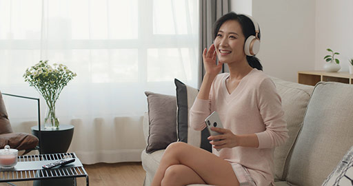 Happy young Chinese woman listening to music,4K