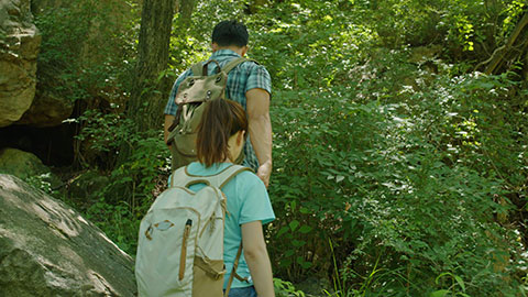 Happy young Chinese couple hiking outdoors,4K