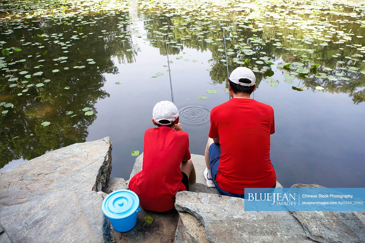 Chinese father and son fishing