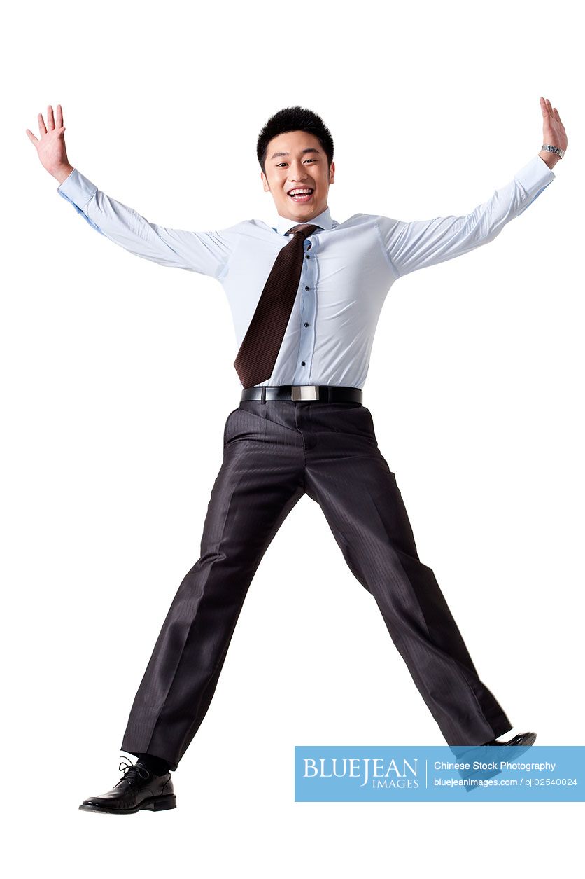 Portrait of a Chinese businessman jumping up