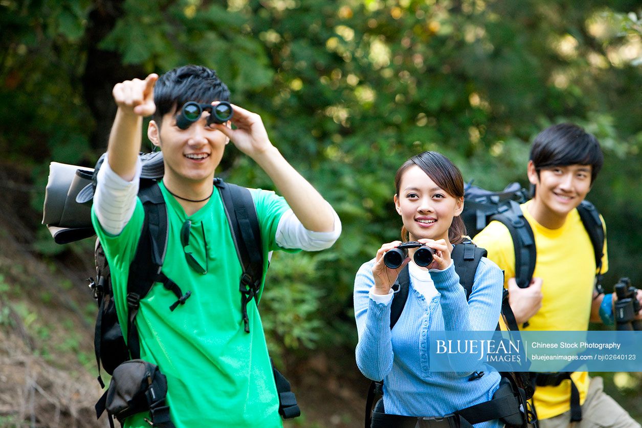 Young Chinese go hiking in mountain