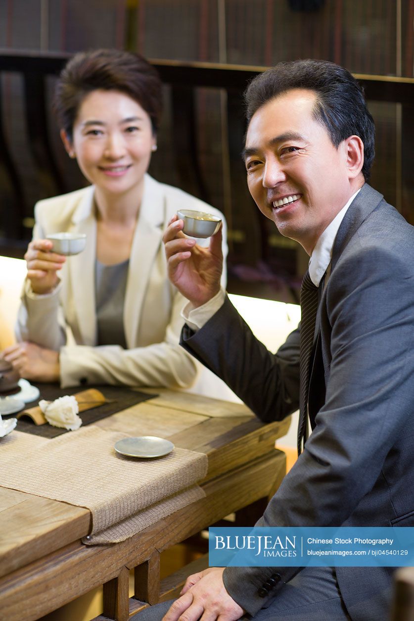 Chinese business person drinking tea in tea room