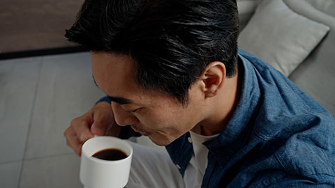 Mid adult Chinese man drinking coffee at home,4K