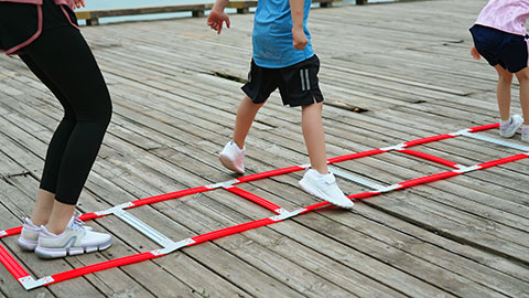 A young family works out in the park, staying active and healthy