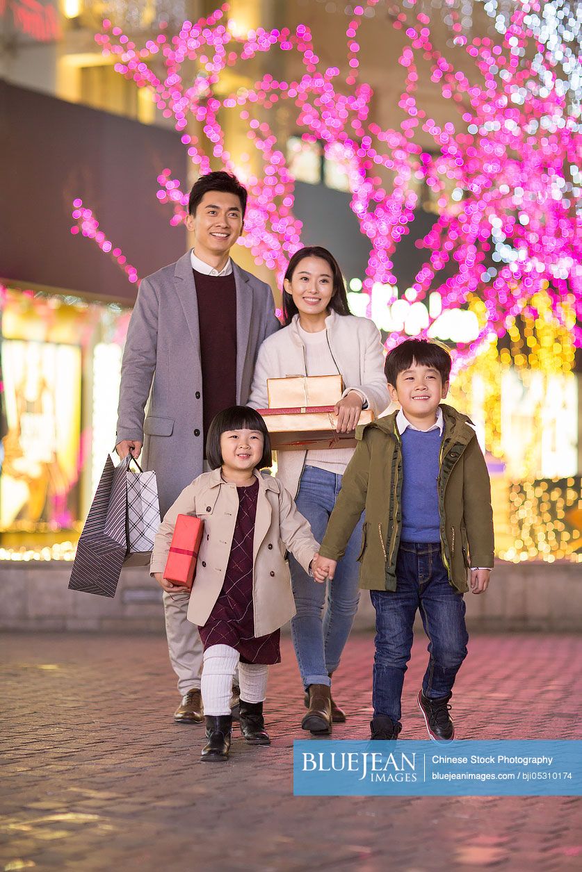 Cheerful young family shopping for Chinese new year