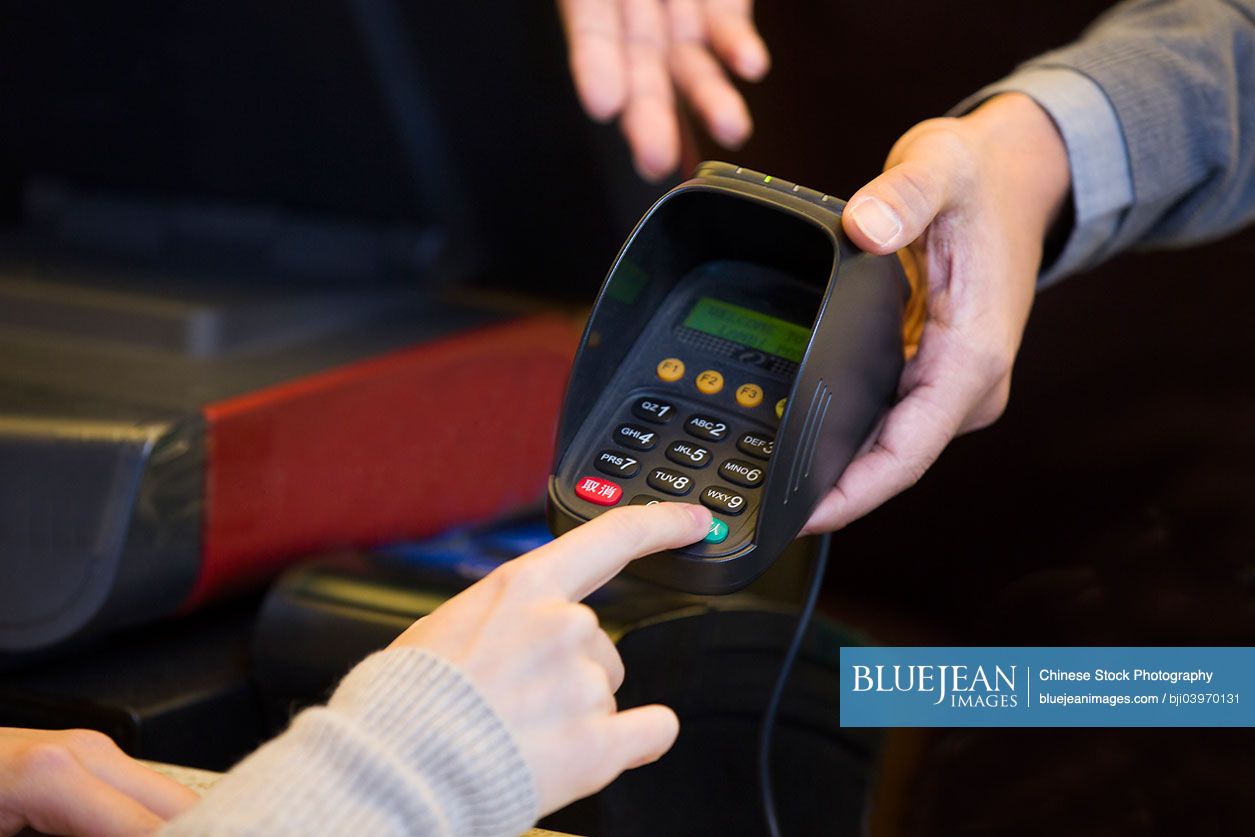Chinese customer entering credit card password