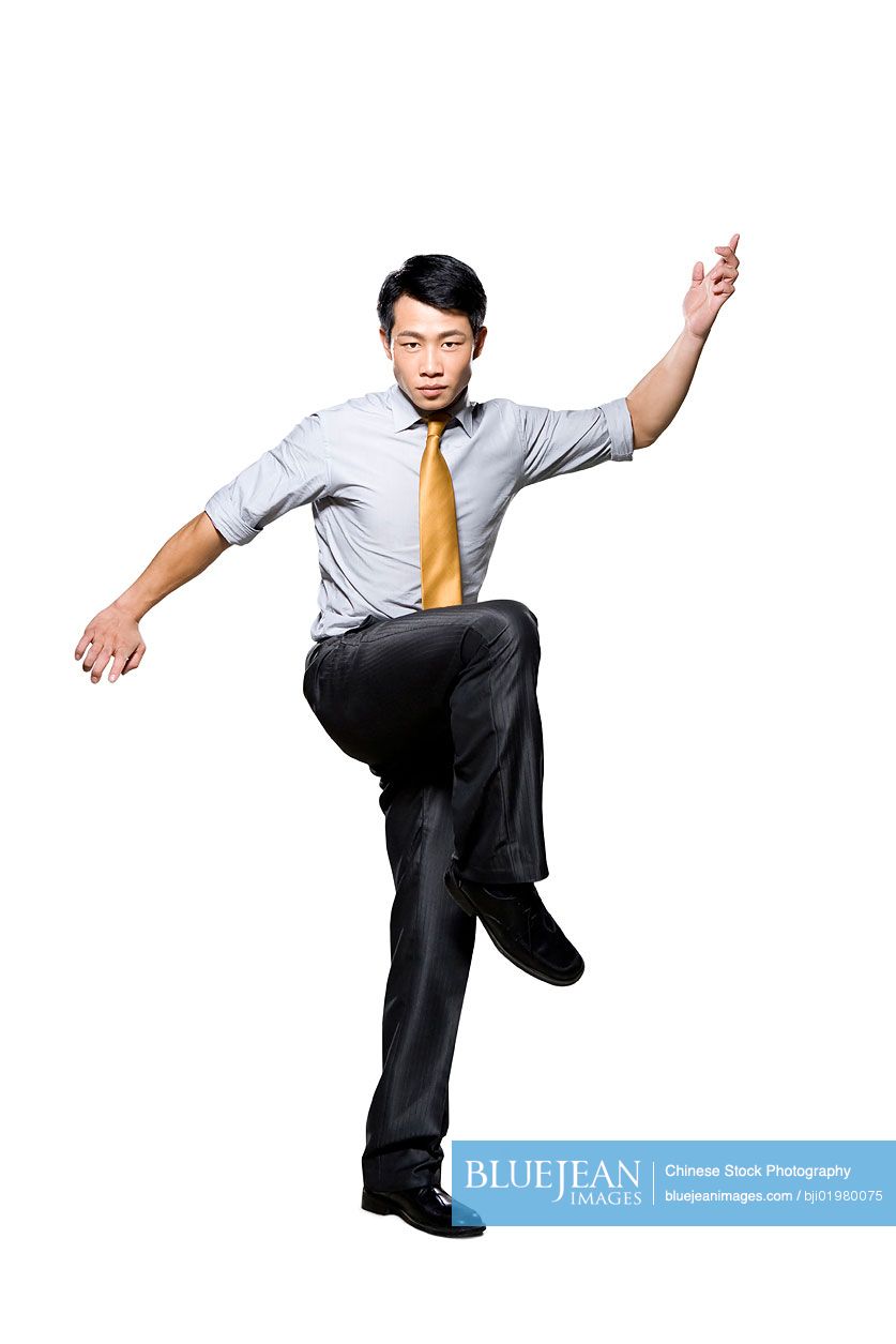 Chinese businessman in martial arts fighting stance