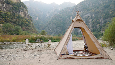 Camping tent by the river