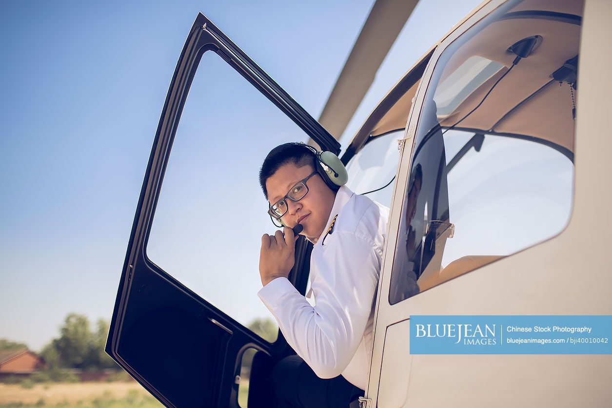 Chinese pilot sitting in helicopter cockpit-High-res stock photo for ...