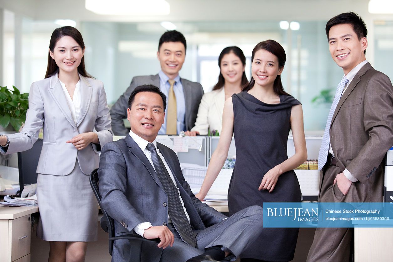 Portrait of cheerful Chinese businesspeople