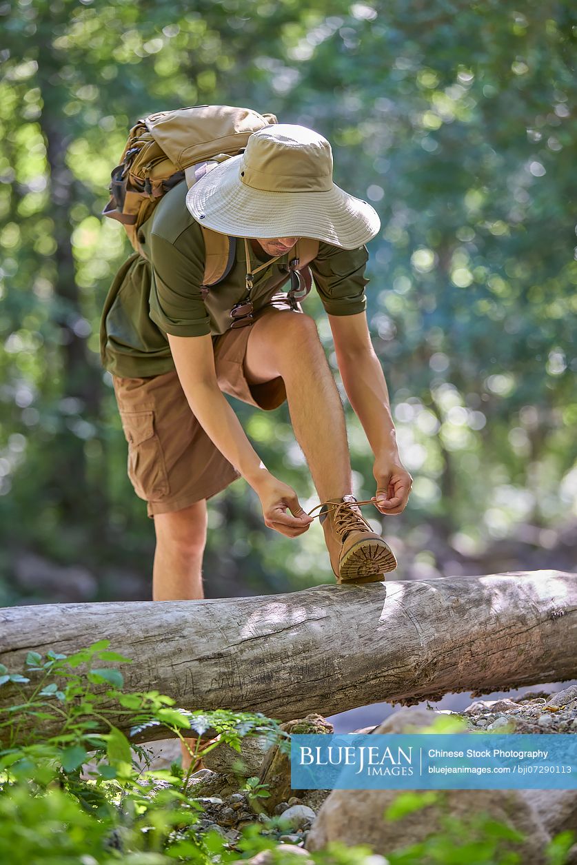Man hiking through the serene beauty of nature