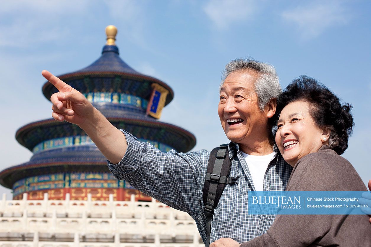 Senior Chinese couple travelling at Temple of Heaven in Beijing, China