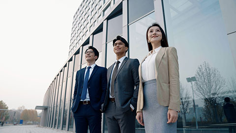 Confident Chinese business people looking at view