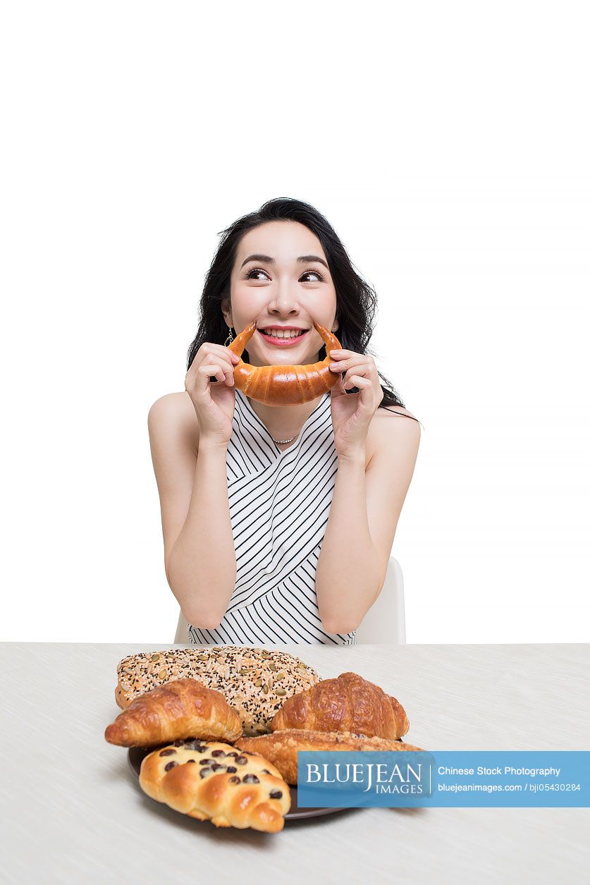 Fashionable young Chinese woman and bread