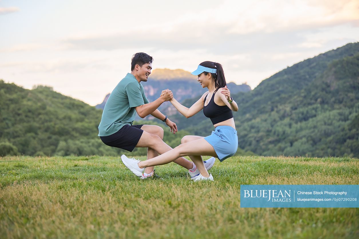 Young couple exercising in the heart of nature embracing the fresh air and natural surroundings