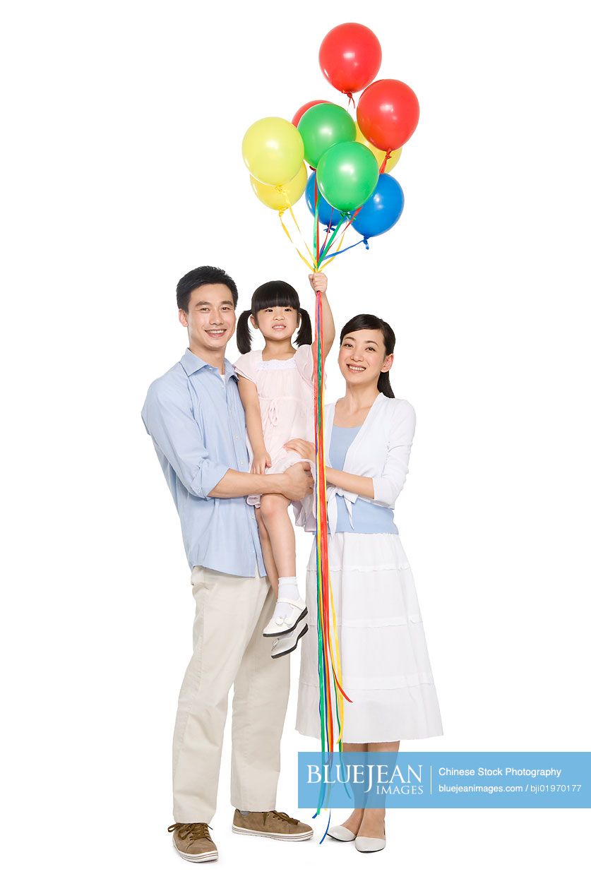 Portrait of Chinese family with balloons