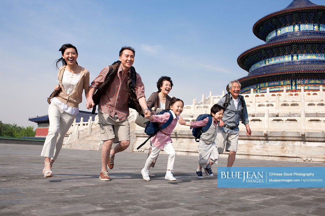 Happy Chinese family travelling at Temple of Heaven in Beijing, China