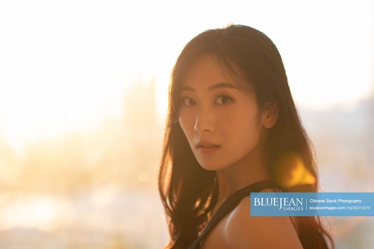 Young Chinese woman exercising at home