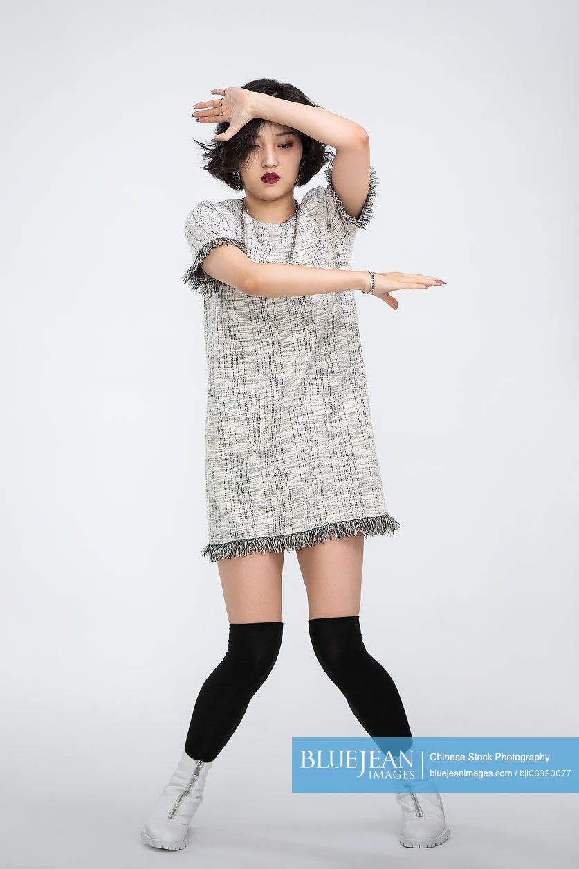 Cool young Chinese woman dancing