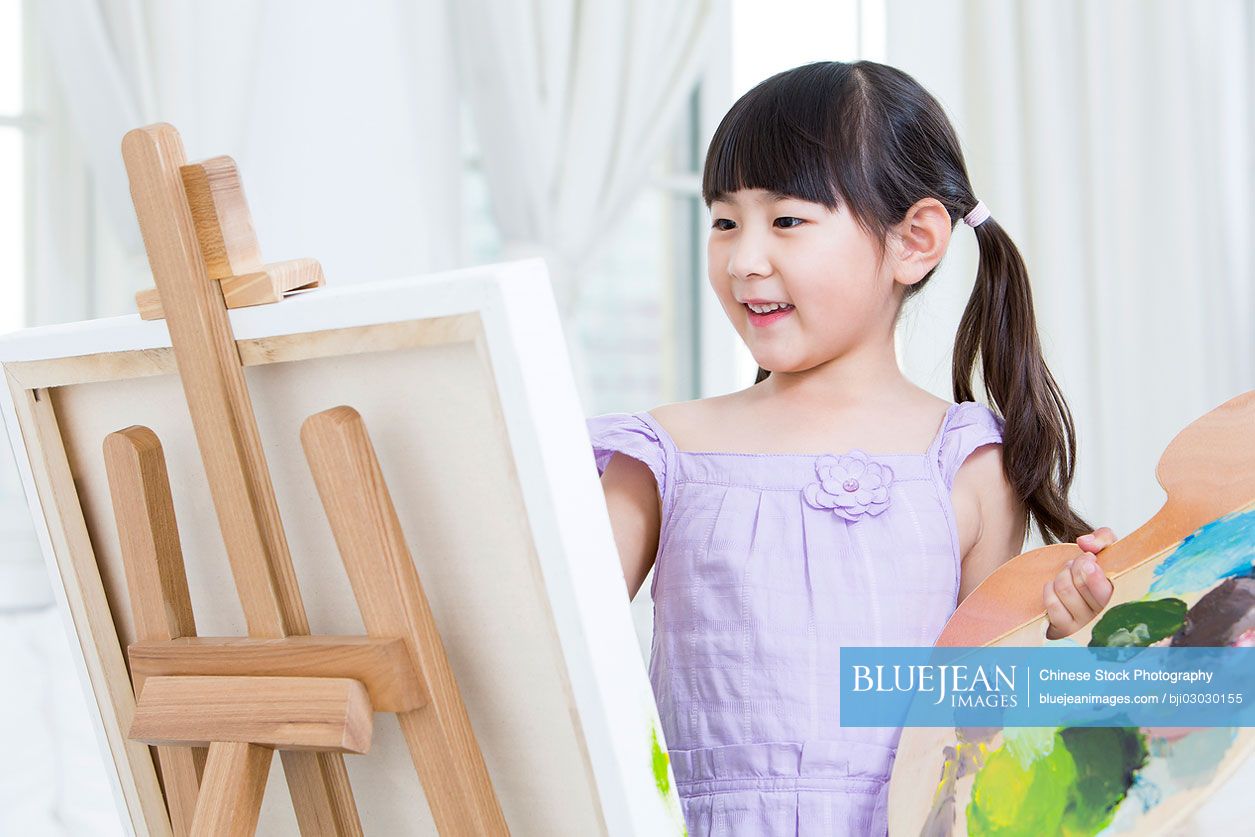 Little Chinese girl painting