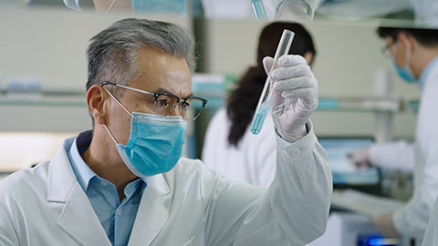 Chinese scientist examining medical sample in laboratory,4K