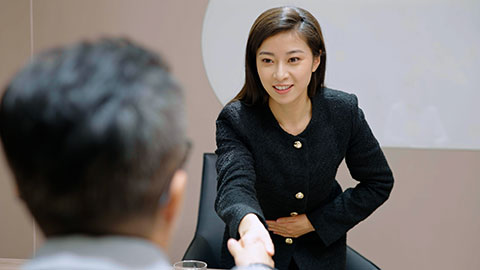 Confident Chinese businesswoman attending job interview