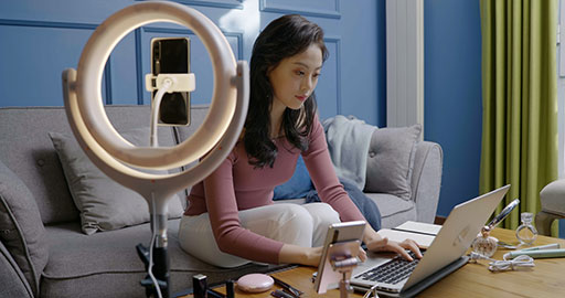 Female influencer live-streaming a product sale