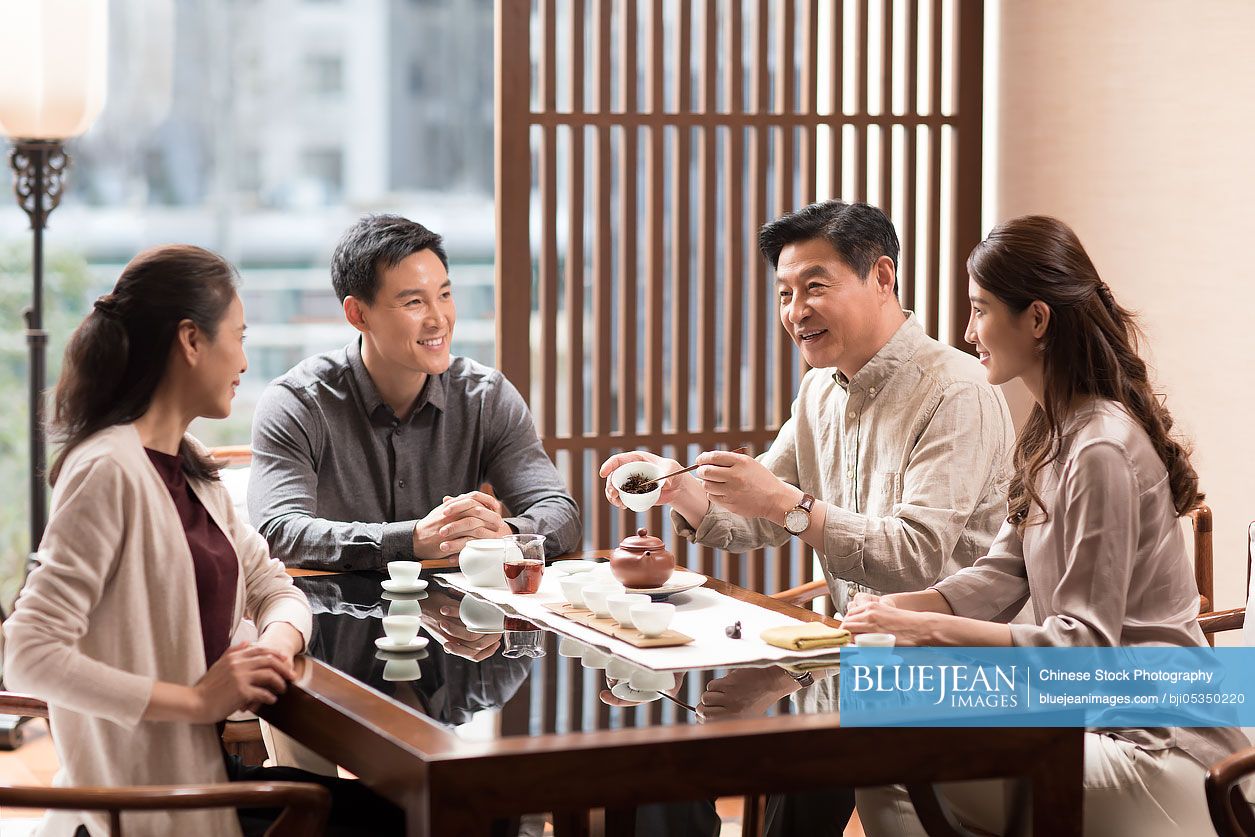 Chinese friends drinking tea together