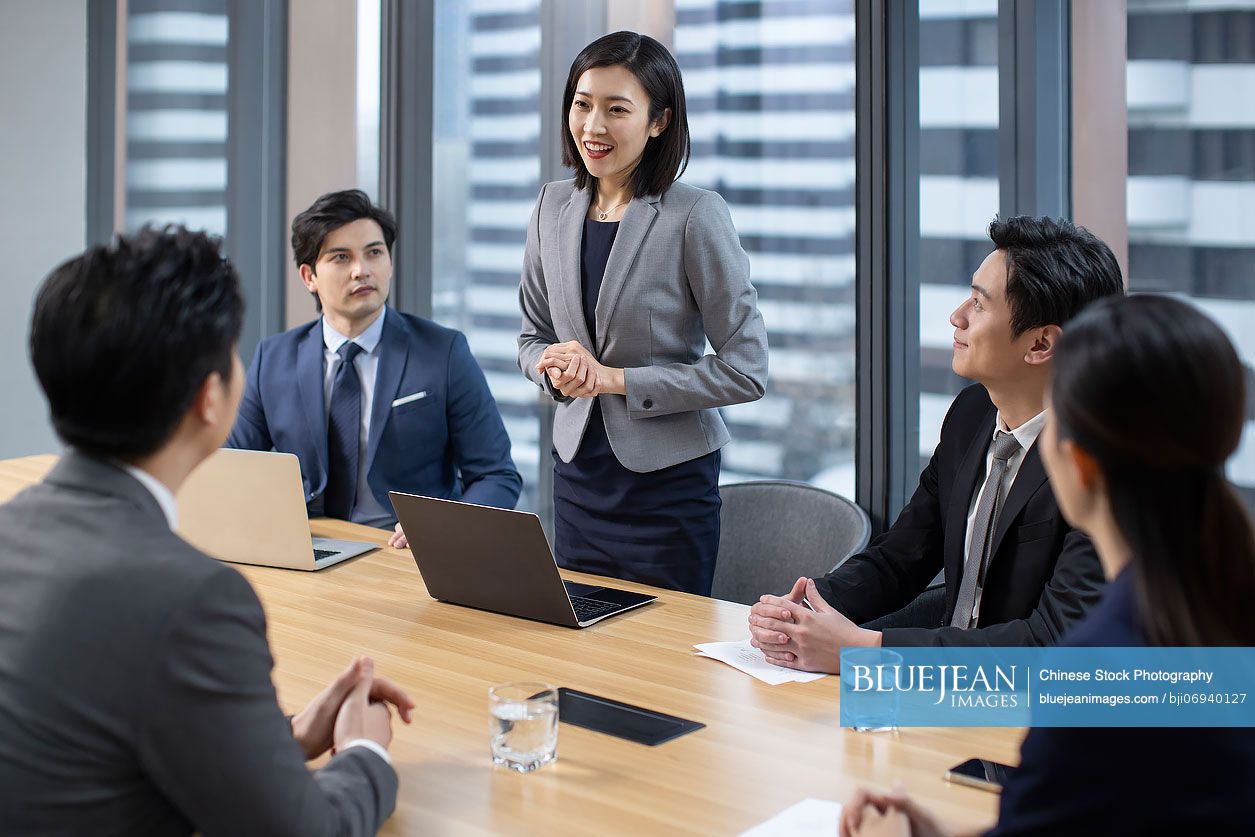 Confident Chinese business people having a meeting