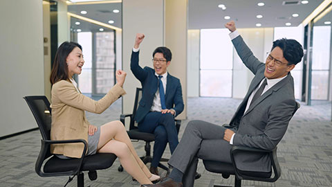 Chinese business people having meeting in empty office