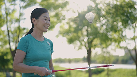 Chinese woman playing badminton