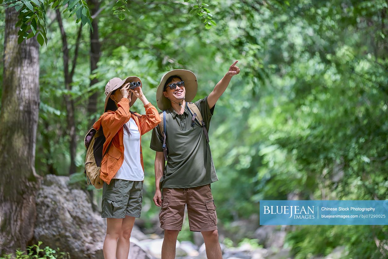 Happy couple hiking through the serene beauty of nature