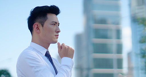 Confident young Chinese businessman thinking,4K