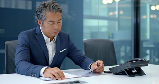 Successful Chinese businessman reading file,4K