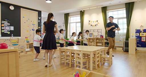 Teachers and children playing games in kindergarten classroom,4K