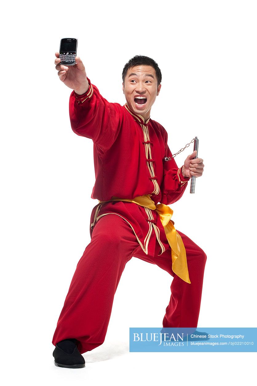 Chinese man in traditional clothing doing martial arts