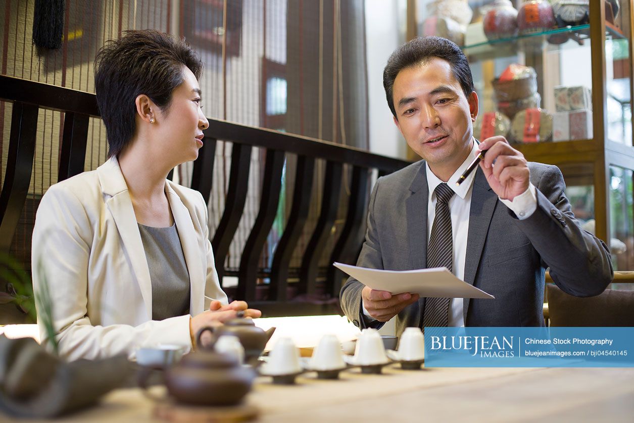 Chinese business person discussing in tea roomHighres stock photo for