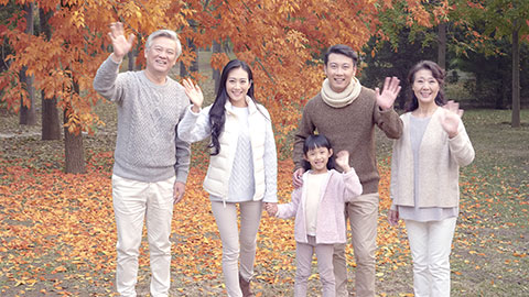 Happy Chinese family having fun in autumn woods,4K