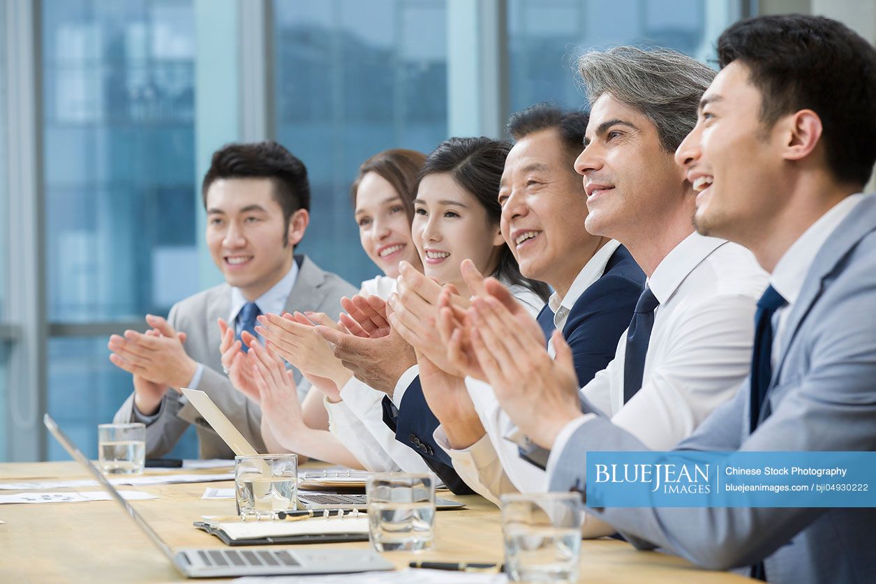 Business people having meeting in board room