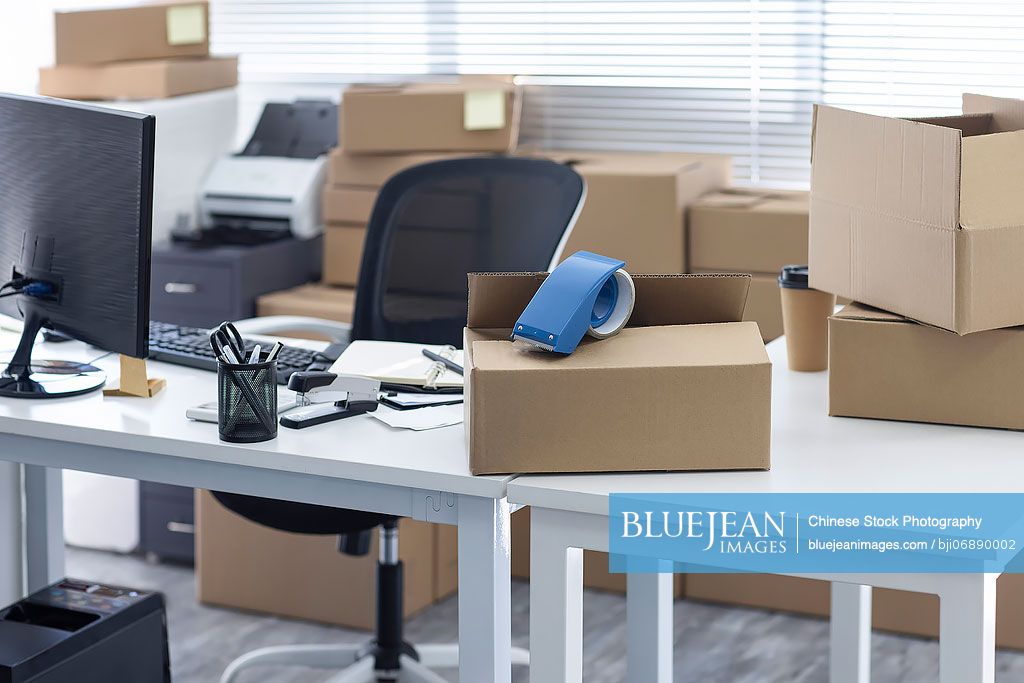 Office table with boxes on it